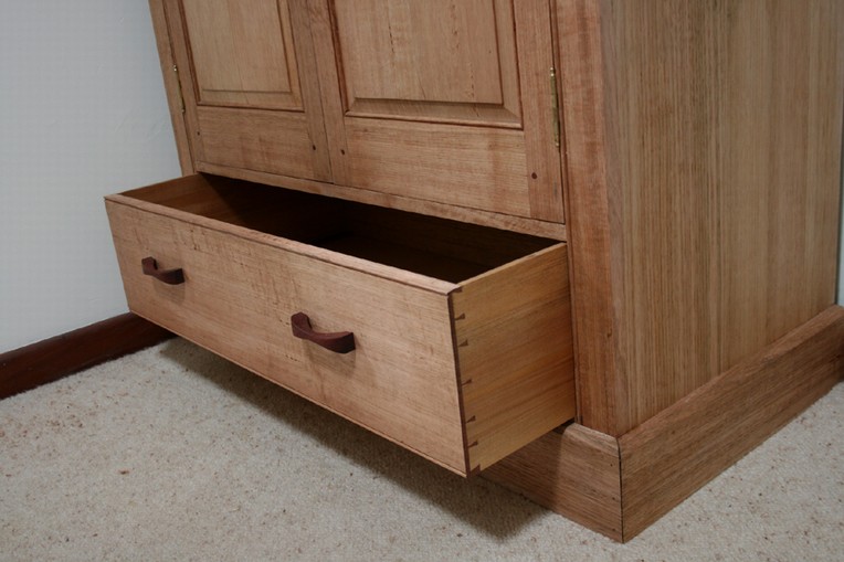 Jarrah kingsize bed and one of a pair of side tables